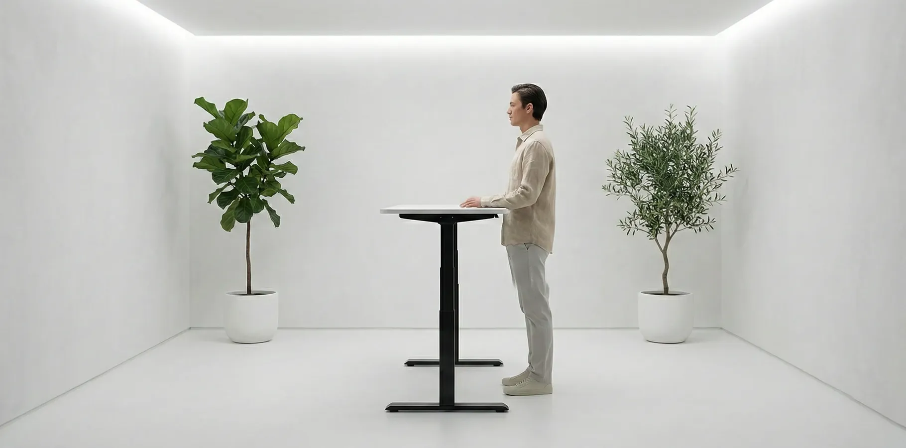 White standing desk in a bright office, symbolizing energy and movement